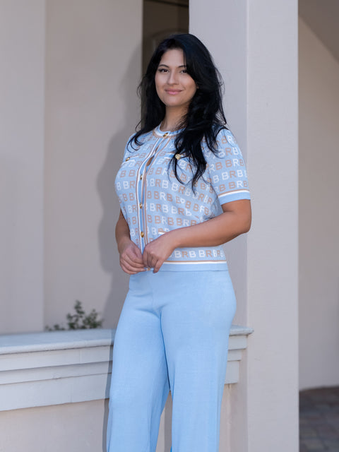 Blue knitted jacket with short sleeves with Knitted pants — ITALICA Boutique Sarasota lifestyle