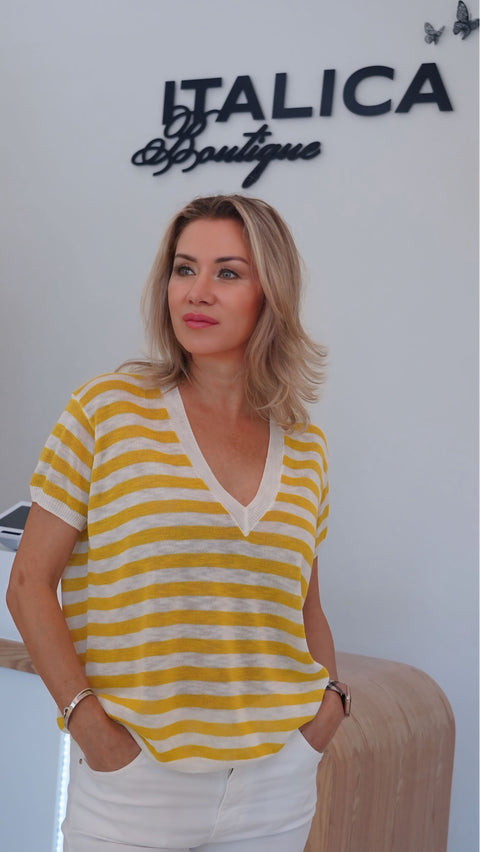 Yellow and white striped knit top with a V-neck